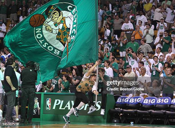 Boston Celtics mascot Lucky the Leprechaun gets the crowd going during the pre game festivities. Boston Celtics NBA basketball, action and reaction....