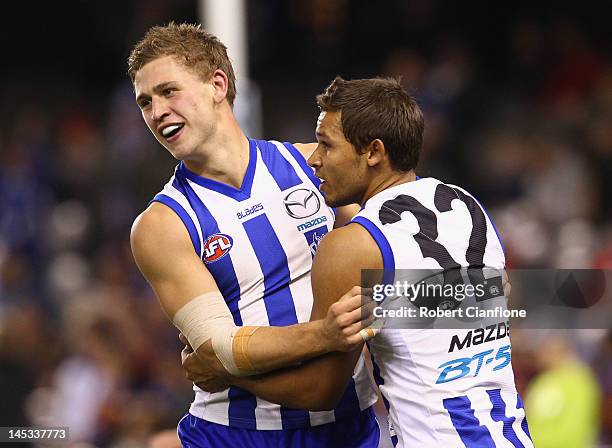 Kieran Harper of the Kangaroos celebrates a goal with Cruize Garlett during the round nine AFL match between the North Melbourne Kangaroos and the...