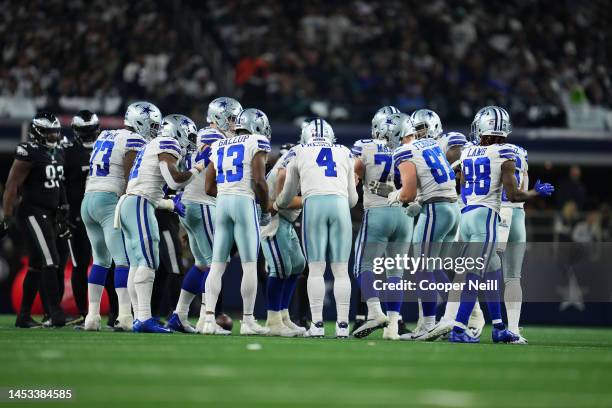 Dak Prescott of the Dallas Cowboys leads the offensive huddle against the Philadelphia Eagles at AT&T Stadium on December 24, 2022 in Arlington,...