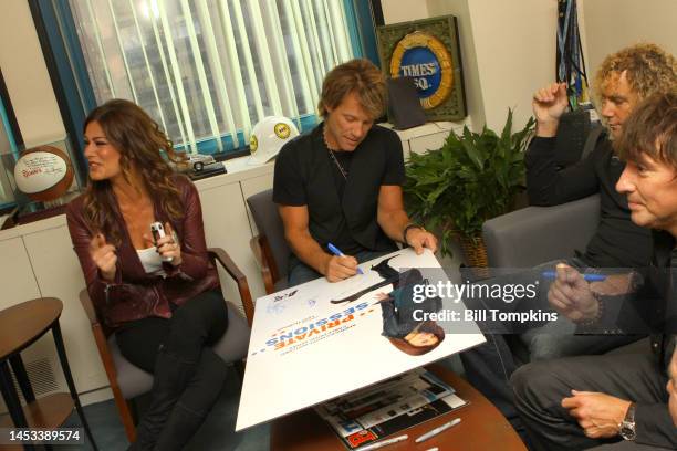 Jon Bon Jovi signing memorbilia backstage during a TV program on December 18, 2008 in New York City.