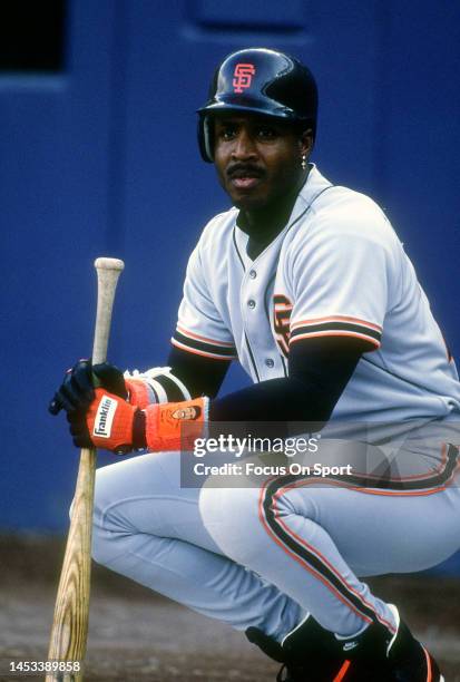 Barry Bonds of the San Francisco Giants looks on from the on-deck circle against the New York Mets during a Major League Baseball game circa 1993 at...