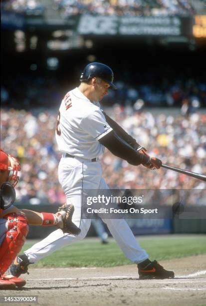 Cal Ripken Jr. #8 of the Baltimore Orioles bats against the Texas Rangers during a Major League Baseball game circa 1996 at Oriole Park at Camden...