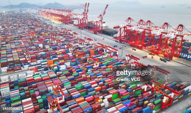 Aerial view of shipping containers sitting stacked at an automated container terminal of Yangshan Deepwater Port, operated by Shanghai International...