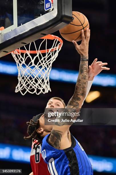 Markelle Fultz of the Orlando Magic shoots the ball against Kristaps Porzingis of the Washington Wizards in the first half of a game at Amway Center...