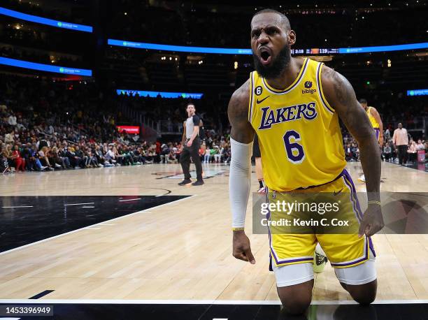 LeBron James of the Los Angeles Lakers reacts after drawing a foul on a basket against the Atlanta Hawks during the fourth quarter at State Farm...