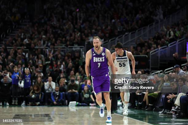 Joe Ingles of the Milwaukee Bucks reacts to a score during the second half of a game against the Minnesota Timberwolves at Fiserv Forum on December...