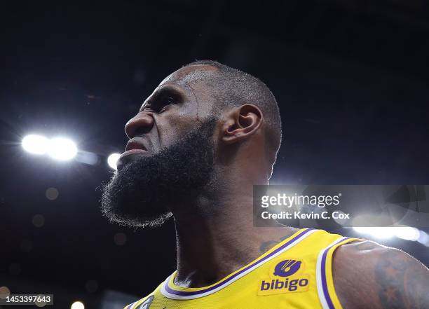 LeBron James of the Los Angeles Lakers reacts after drawing a foul on a basket against Onyeka Okongwu of the Atlanta Hawks during the fourth quarter...