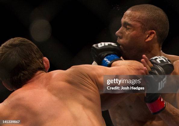 Janmie Varner Jamie Varner punches Edson Barboza during a lightweight bout at UFC ...