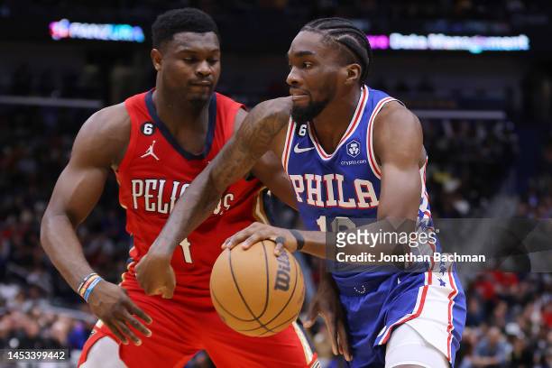 Shake Milton of the Philadelphia 76ers drives against Zion Williamson of the New Orleans Pelicans during the second half at the Smoothie King Center...