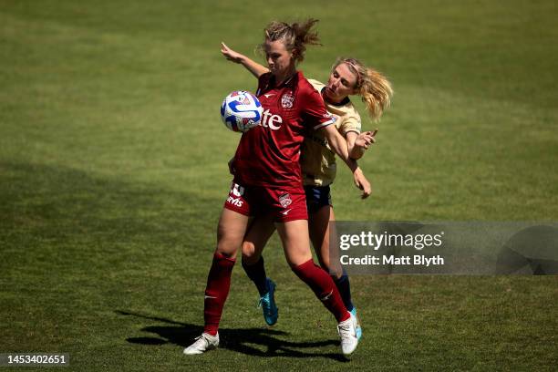 Chelsie Dawber of Adelaide and Cannon Clough of the Jets compete for the ball during the round eight A-League Women's match between Newcastle Jets...