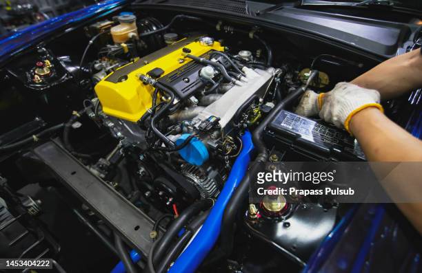 auto mechanic working in garage. repair service. - engine failure stock pictures, royalty-free photos & images