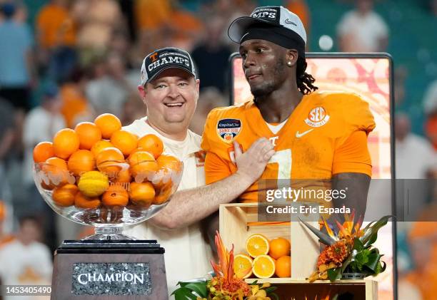 Head coach Josh Heupel and Joe Milton III of the Tennessee Volunteers celebrate on stage after defeating the Clemson Tigers in the Capital One Orange...