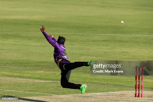 Shadab Khan of the Hurricanes tries to catch a shot off Alex Hales of the Thunder during the Men's Big Bash League match between the Sydney Thunder...