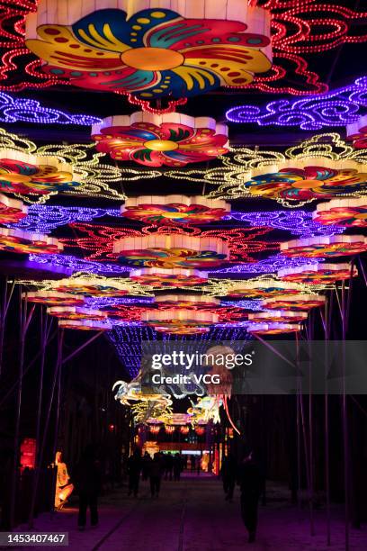 Tourists visit a lantern show as a part of 2023 Shenyang International Ice and Snow Festival at Guandong Movie and TV Town ahead of Chinese New Year,...