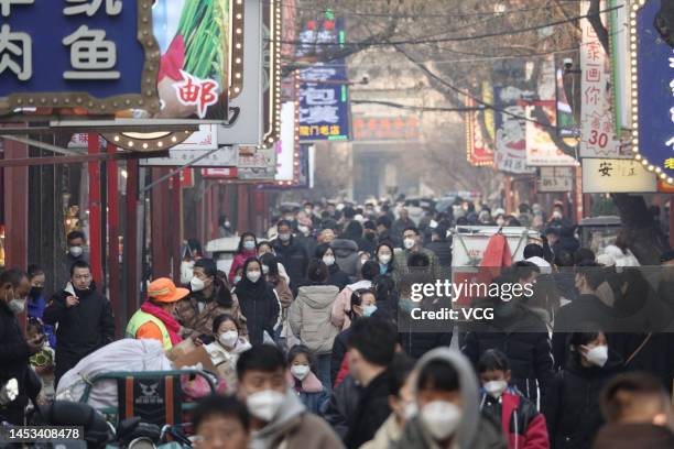 Tourists visit the Muslim Quarter, a very famous snack and commercial street in China, ahead of Chinese New Year, the Year of the Rabbit, on December...