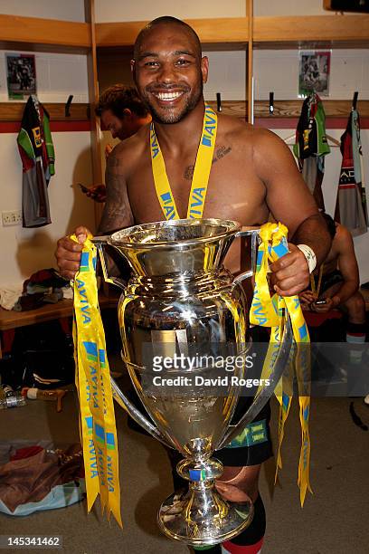 Jordan Turner-Hall of Harlequins poses with the trophy following his team's victory during the Aviva Premiership final between Harlequins and...