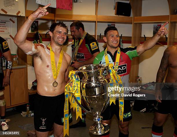 Nick Evans and Danny Care pose with the trophy following their team's victory during the Aviva Premiership final between Harlequins and Leicester...