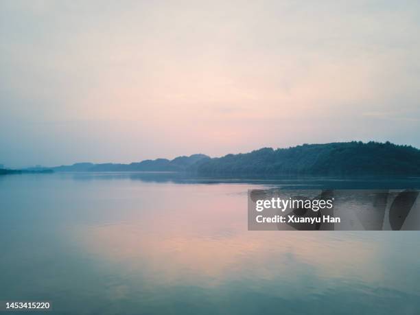 mountain lake at sunset - water surface line stock pictures, royalty-free photos & images