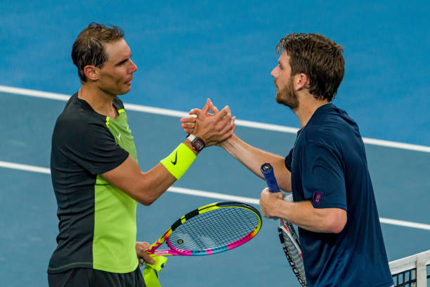 Cameron Norrie of Great Britain shakes hands with Rafael Nadal of Spain after winning match point in their Group D match during day three of the 2023...