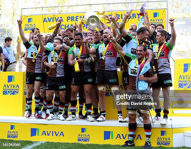 Harlequins captain Chris Robshaw lifts the trophy following his team's victory during the Aviva Premiership final between Harlequins and Leicester...