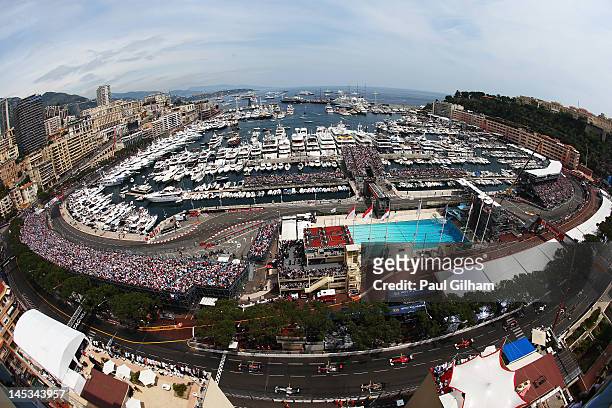 The field led by Mark Webber of Australia and Red Bull Racing gets underway at the start of the Monaco Formula One Grand Prix at the Circuit de...