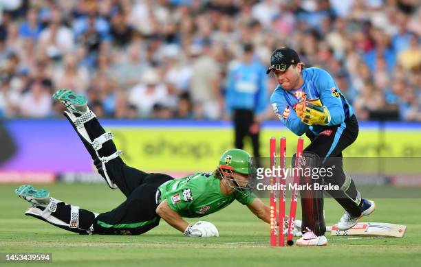 Harry Nielsen of the Strikers runs out Campbell Kellaway of the Stars during the Men's Big Bash League match between the Adelaide Strikers and the...