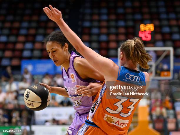 Olivia Nelson-Ododa of the Boomers attempts to get past Mikaela Ruef of the Fire during the round eight WNBL match between Townsville Fire and...