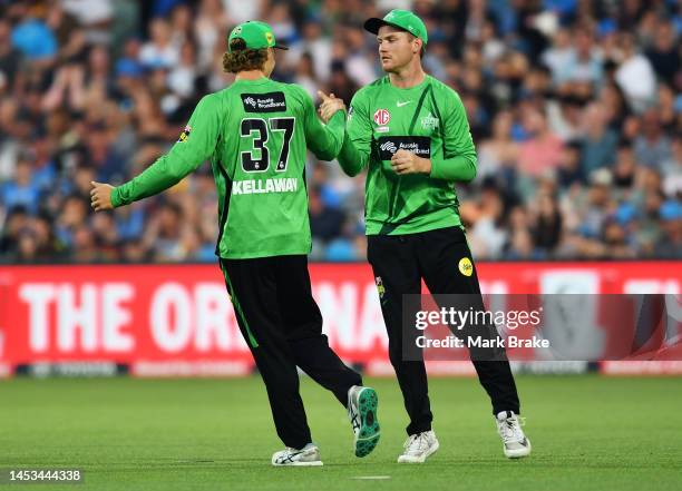 Tom Rogers celebrates after catching the wicket of Matt Short of the Strikers with Campbell Kellaway of the Stars during the Men's Big Bash League...