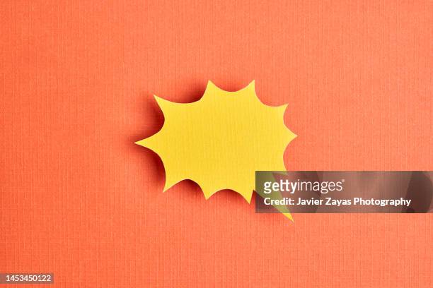 yellow comic bubble on orange background - comic book speech bubble stock pictures, royalty-free photos & images