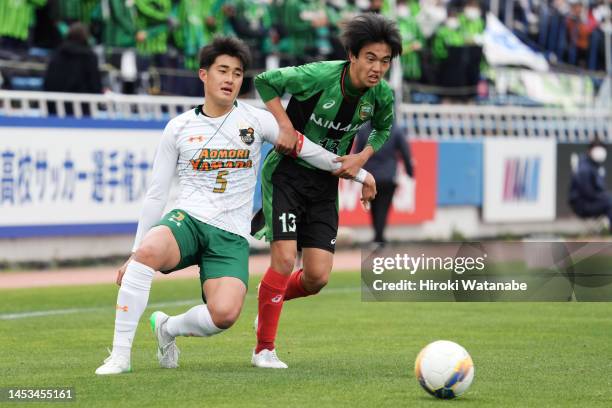 Yoshiki Takushima of Aomori Yamada and Ryu Watanabe of Hiroshima Minami compete for the ball during the 101st All Japan High School Soccer Tournament...