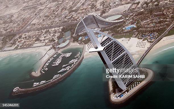 An aerial view of the 321 meter tall Burj Al-Arab luxury hotel built on an artificial island off Jumeirah in the Gulf emirate of Dubai on May 27,...
