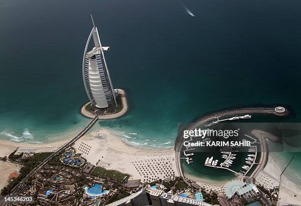 An aerial view of the 321 meter tall Burj Al-Arab luxury hotel built on an artificial island off Jumeirah in the Gulf emirate of Dubai on May 27,...