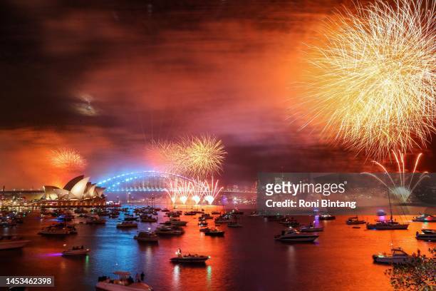 Fireworks light up the sky over Sydney Harbour Bridge during New Year's Eve celebration on January 01, 2023 in Sydney, Australia. Revelers turned out...