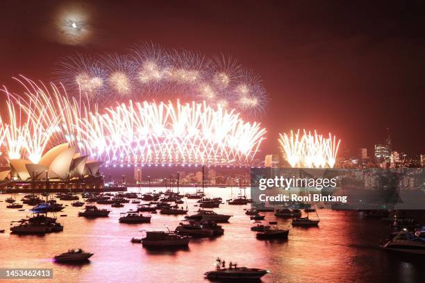 Fireworks light up the sky over Sydney Harbour Bridge during New Year's Eve celebration on January 01, 2023 in Sydney, Australia. Revelers turned out...