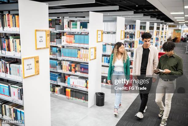 Running Inthe Library 873 Young Adults Walking Library Stock Photos, High-Res Pictures, and ...