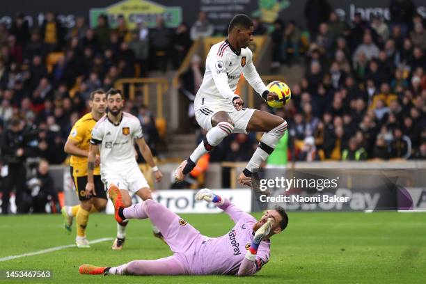 Marcus Rashford of Manchester United scores a goal as Jose Sa of Wolverhampton Wanderers attempt to make a save, which is later disallowed following...