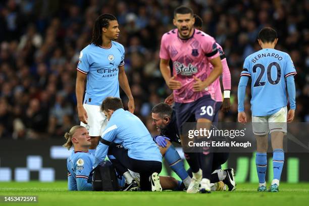 Erling Haaland of Manchester City receives medical treatment during the Premier League match between Manchester City and Everton FC at Etihad Stadium...