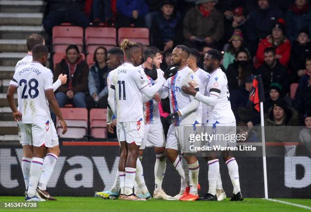 Jordan Ayew of Crystal Palace celebrates after scoring the team's first goal with teammates during the Premier League match between AFC Bournemouth...