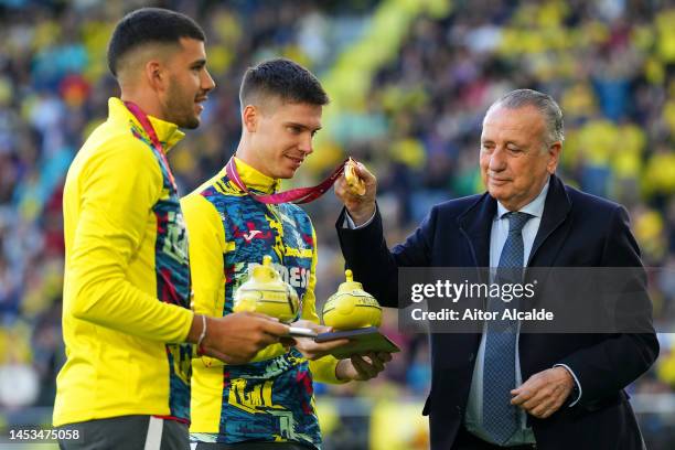 Fernando Roig Alfonso, President of Villarreal CF, awards Villarreal CF Submarines to Juan Foyth and Geronimo Rulli, after winning the FIFA World Cup...