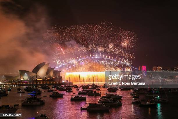 Fireworks light up over Sydney Harbour Bridge during New Year's Eve celebrations on January 01, 2023 in Sydney, Australia. Revelers turned out in...