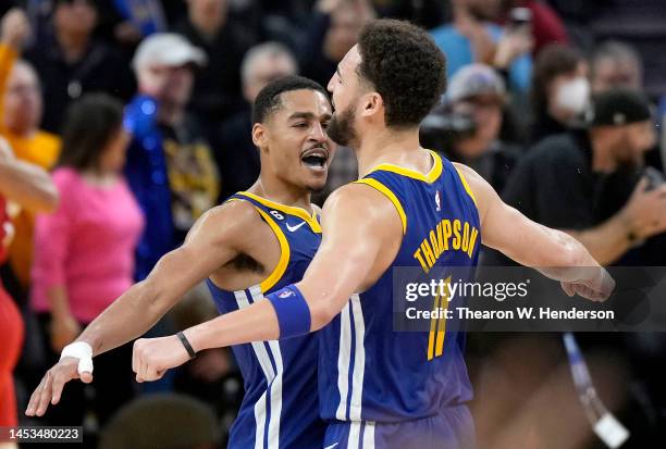 Jordan Poole and Klay Thompson of the Golden State Warriors celebrates after they defeated the the Portland Trail Blazers 118-112 at Chase Center on...