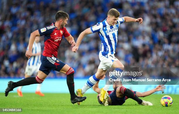 Alexander Sorloth of Real Sociedad is challenged by Unai Garcia of CA Osasuna during the LaLiga Santander match between Real Sociedad and CA Osasuna...