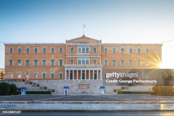 the greek parliament during sunrise in athens, greece - greek parliament stock-fotos und bilder