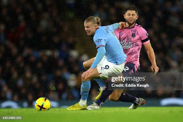 James Tarkowski of Everton clashes with Erling Haaland of Manchester City during the Premier League match between Manchester City and Everton FC at...