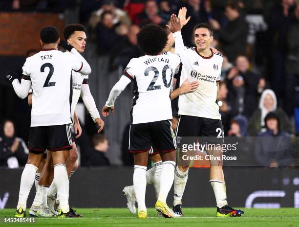Joao Palhinha of Fulham celebrates with teammates after scoring the team's second goal during the Premier League match between Fulham FC and...
