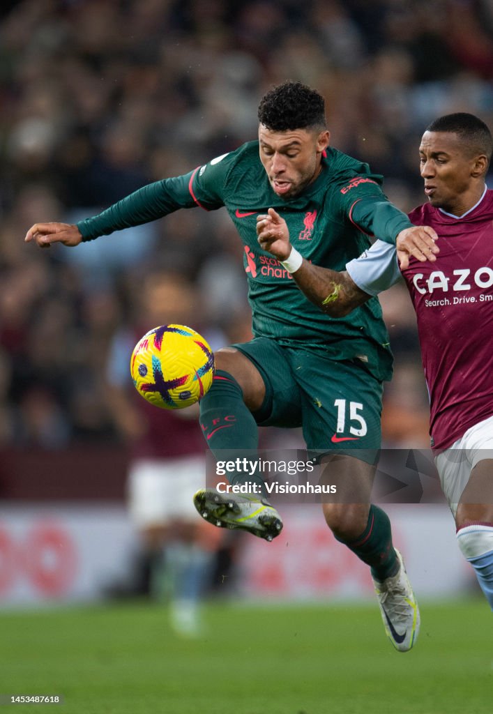 Alex Oxlade-Chamberlain of Liverpool and Ashley Young of Aston Villa