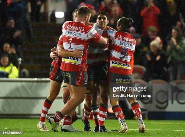 Santiago Carreras of Gloucester Rugby celebrates alongside team mates after kicking a penalty in the last minute to win the match following the...