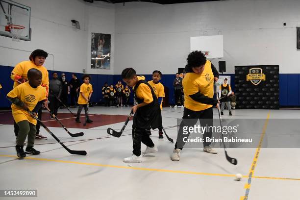 Kids play street hockey during the 2023 NHL Winter Classic Legacy Project at the Boys and Girls Club Marr Clubhouse on December 31, 2022 in...