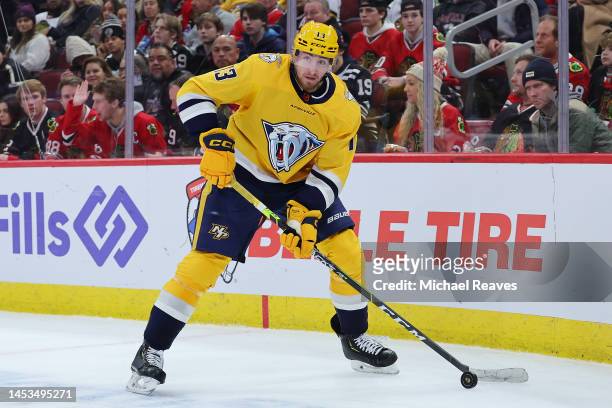 Yakov Trenin of the Nashville Predators skates with the puck against the Chicago Blackhawks during the third period at United Center on December 21,...