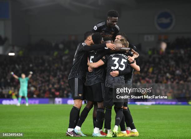 The Arsenal team celebrates the 2nd goal, scored by Martin Odegaard during the Premier League match between Brighton & Hove Albion and Arsenal FC at...